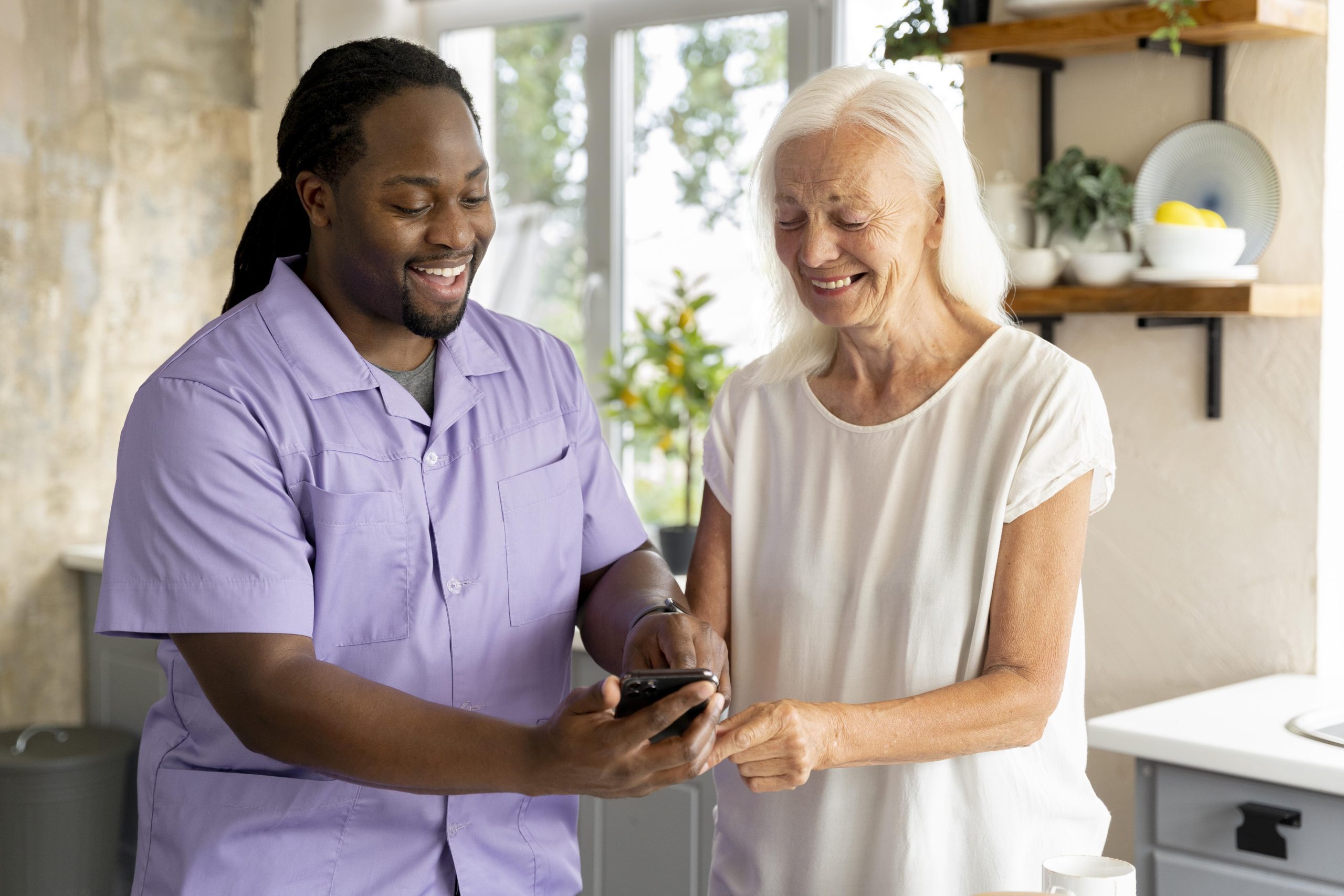 african social worker helping senior woman