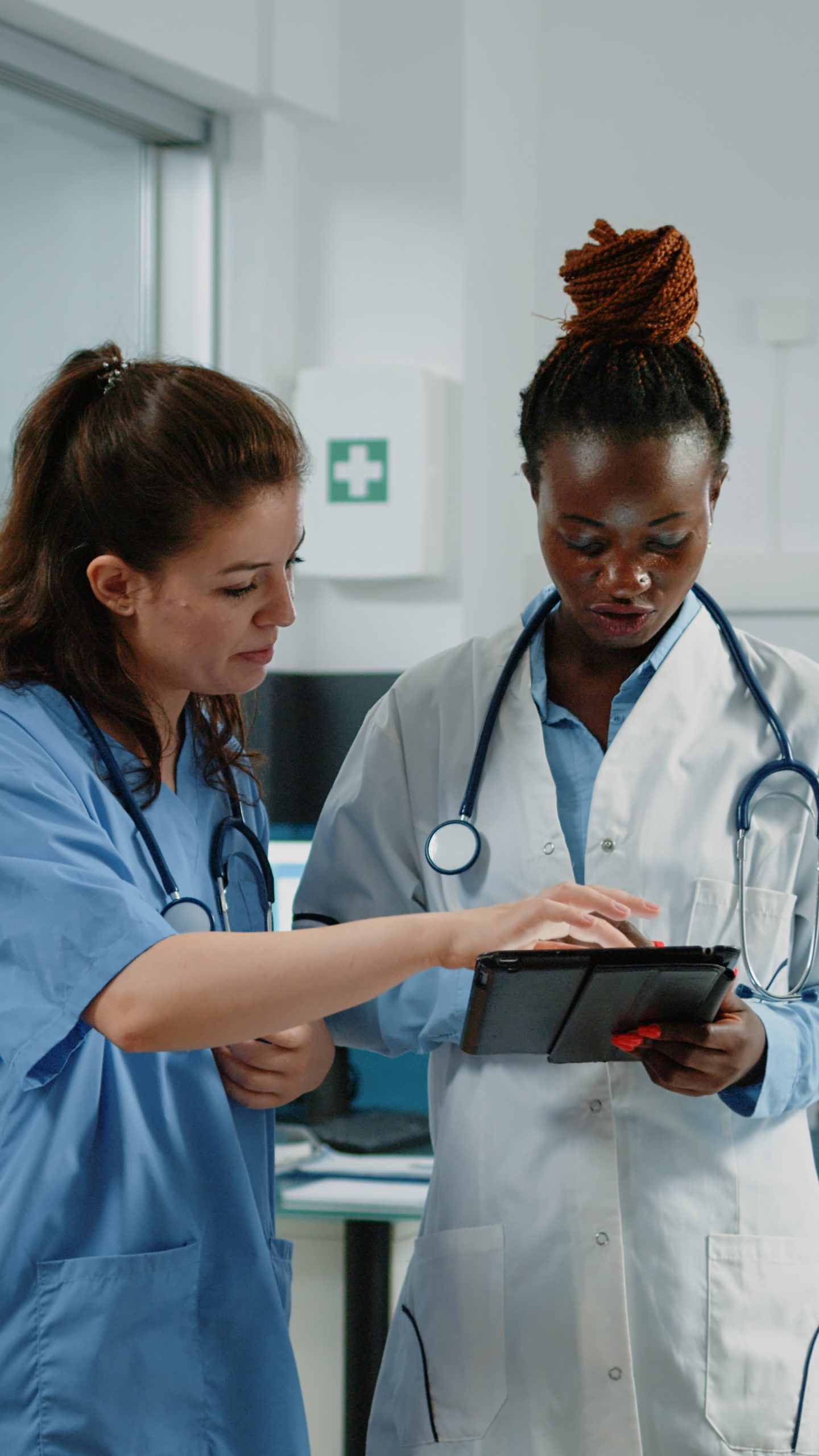 doctor and nurse working with tablet for healthcare system